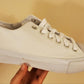 White canvas low-cut lace up sneakers. To be customized.